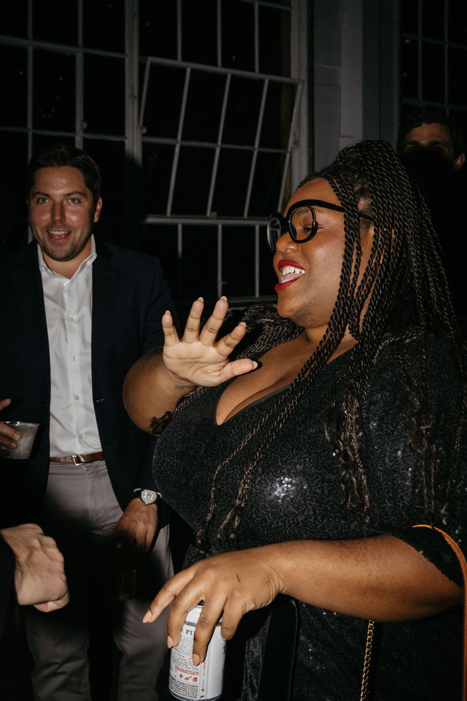 Party guests enjoying themselves on the dance floor at a celebration event.