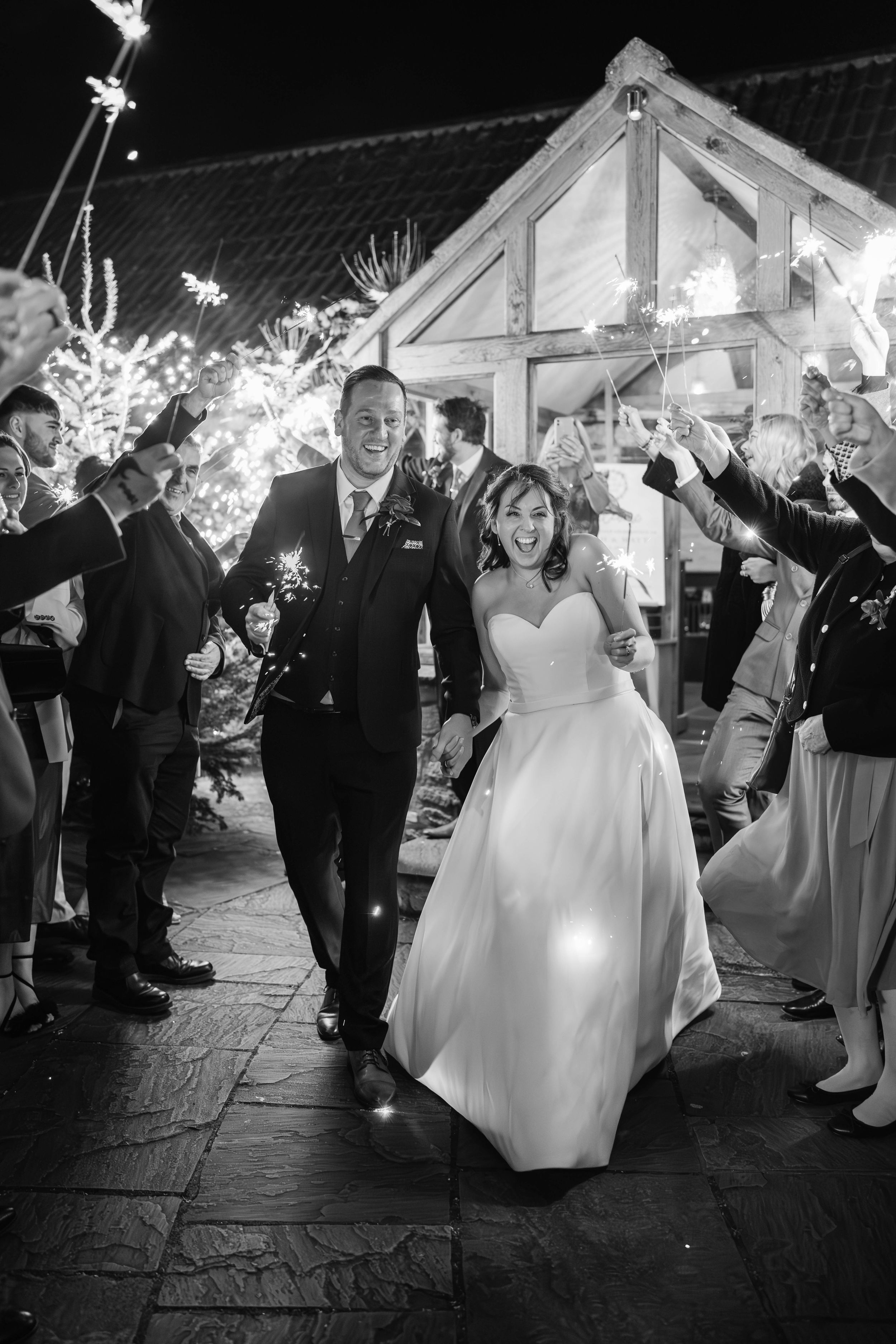 Zara Davis Cotswolds Wedding Photography Cheltenham Gloucestershire Christmas Sparkler exit with bride and groom Priston Mill Bristol Bath