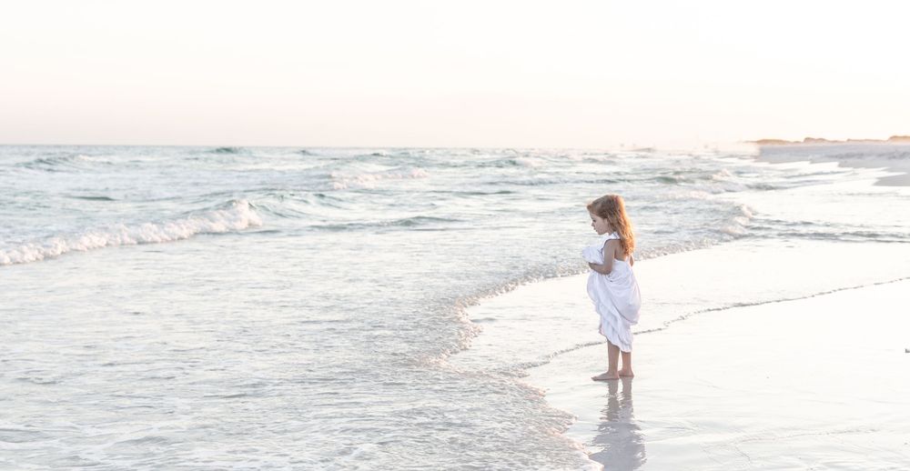Sea Glass Photography of Navarre, Florida offers stunning beach lifestyle candids and traditional family portraits in Navarre Beach, Fl.