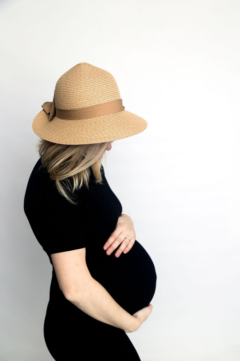 Maternity portrait, black dress on white