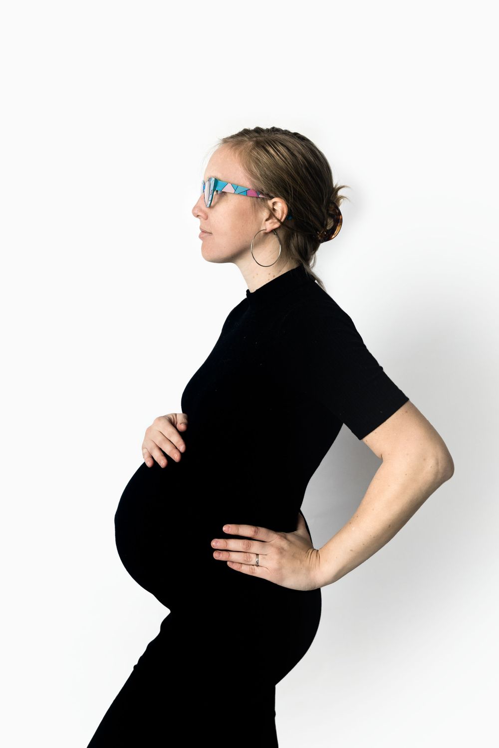 Maternity portrait, black dress on white