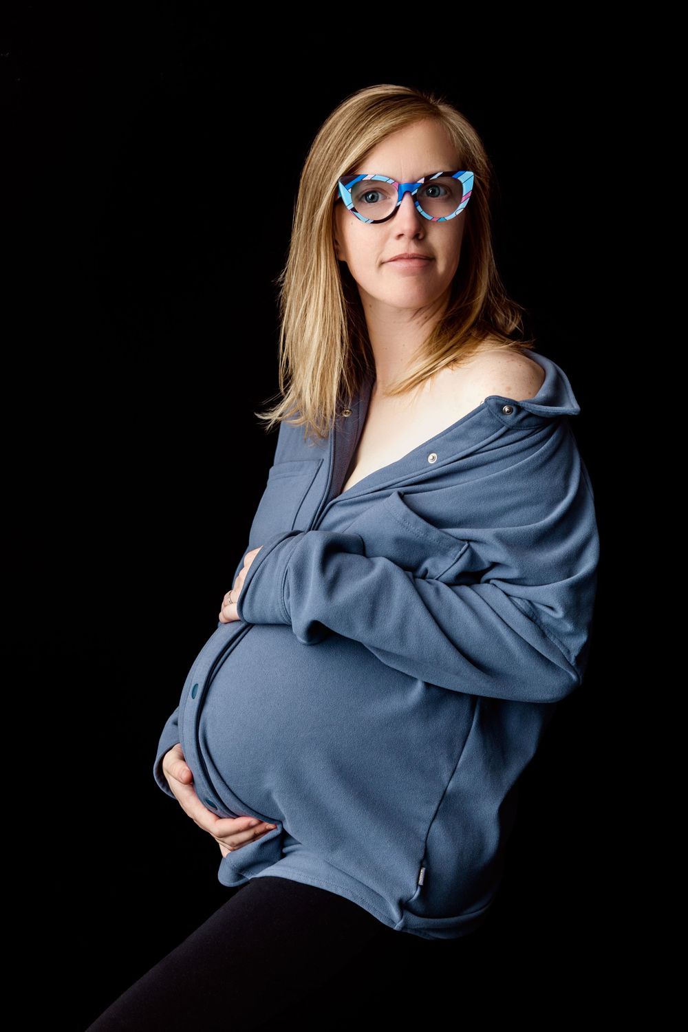Maternity portrait on a black background