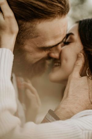 Close-up intimate portrait showing tender moments between two people.