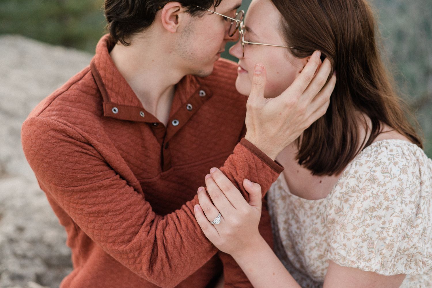 A couple embraces face to face