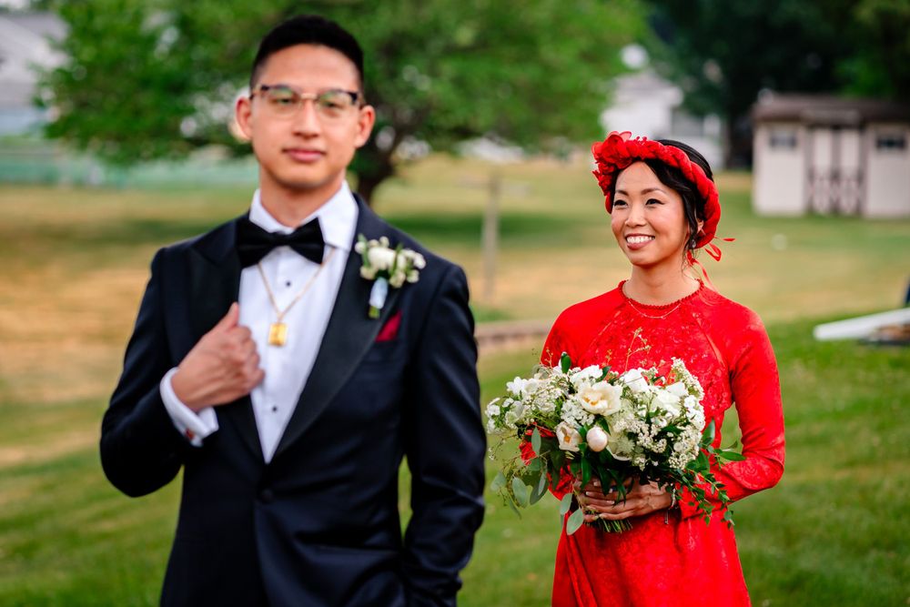 Couple shares joyful moments during outdoor wedding photoshoot.