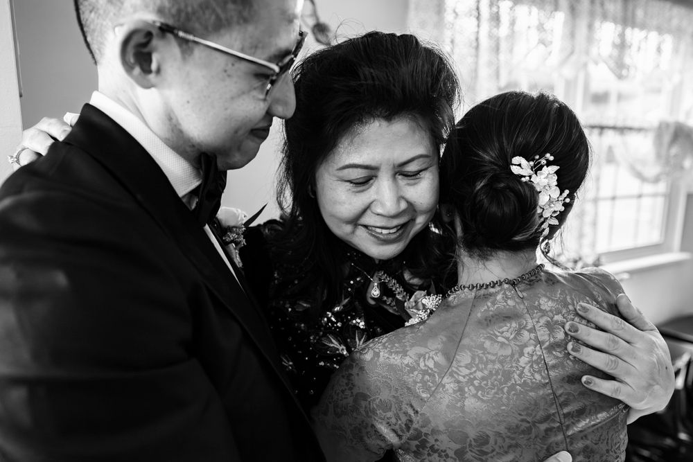 Tender embraces and emotional reactions during pre-wedding preparations.