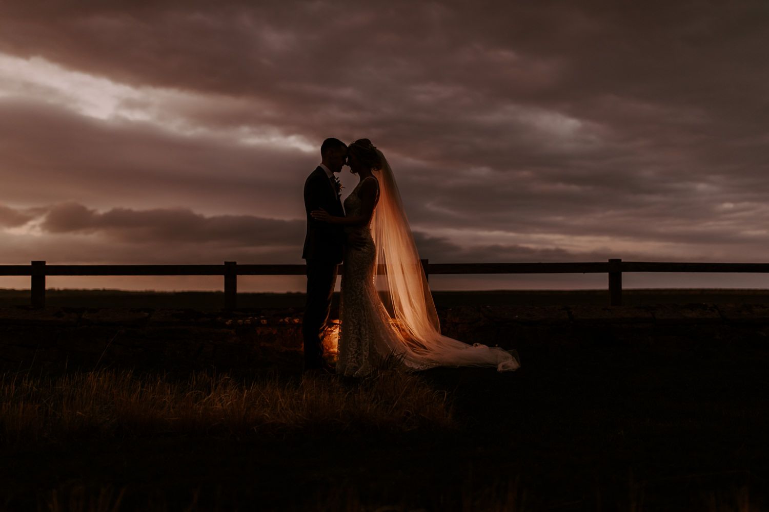 Sunset wedding photo at Newton Hall, by the sea