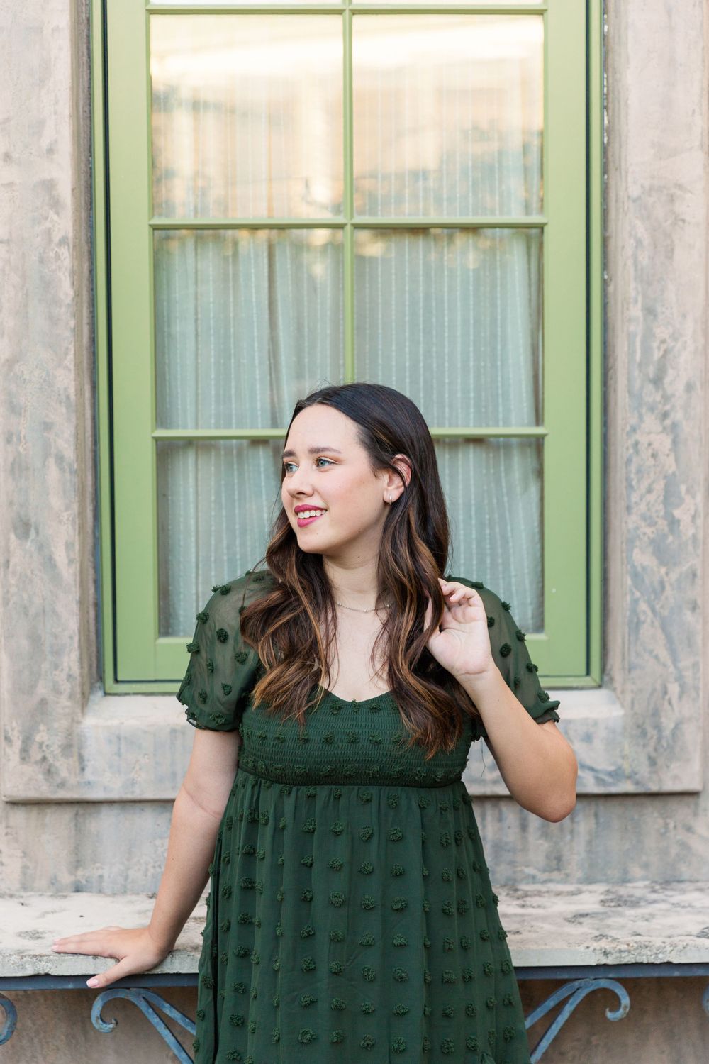 high school graduate portrait green dress and window