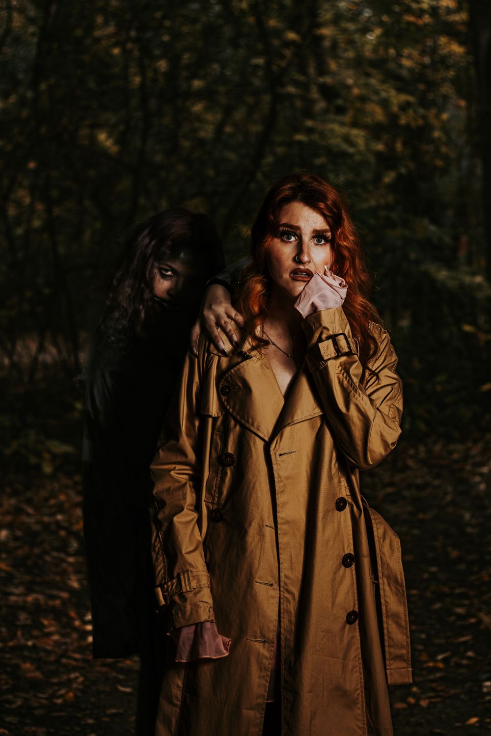 Moody autumn portrait series featuring person in tan trench coat among fallen leaves.