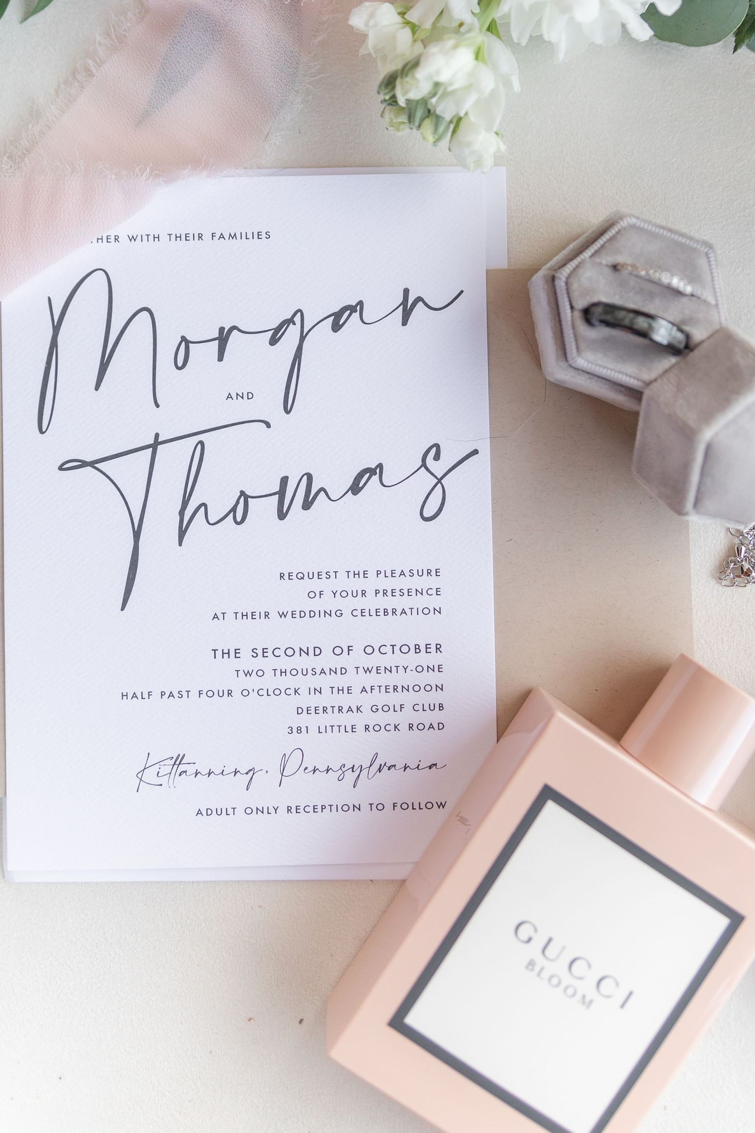 Wedding invitation suite with modern calligraphy and Gucci perfume styling.