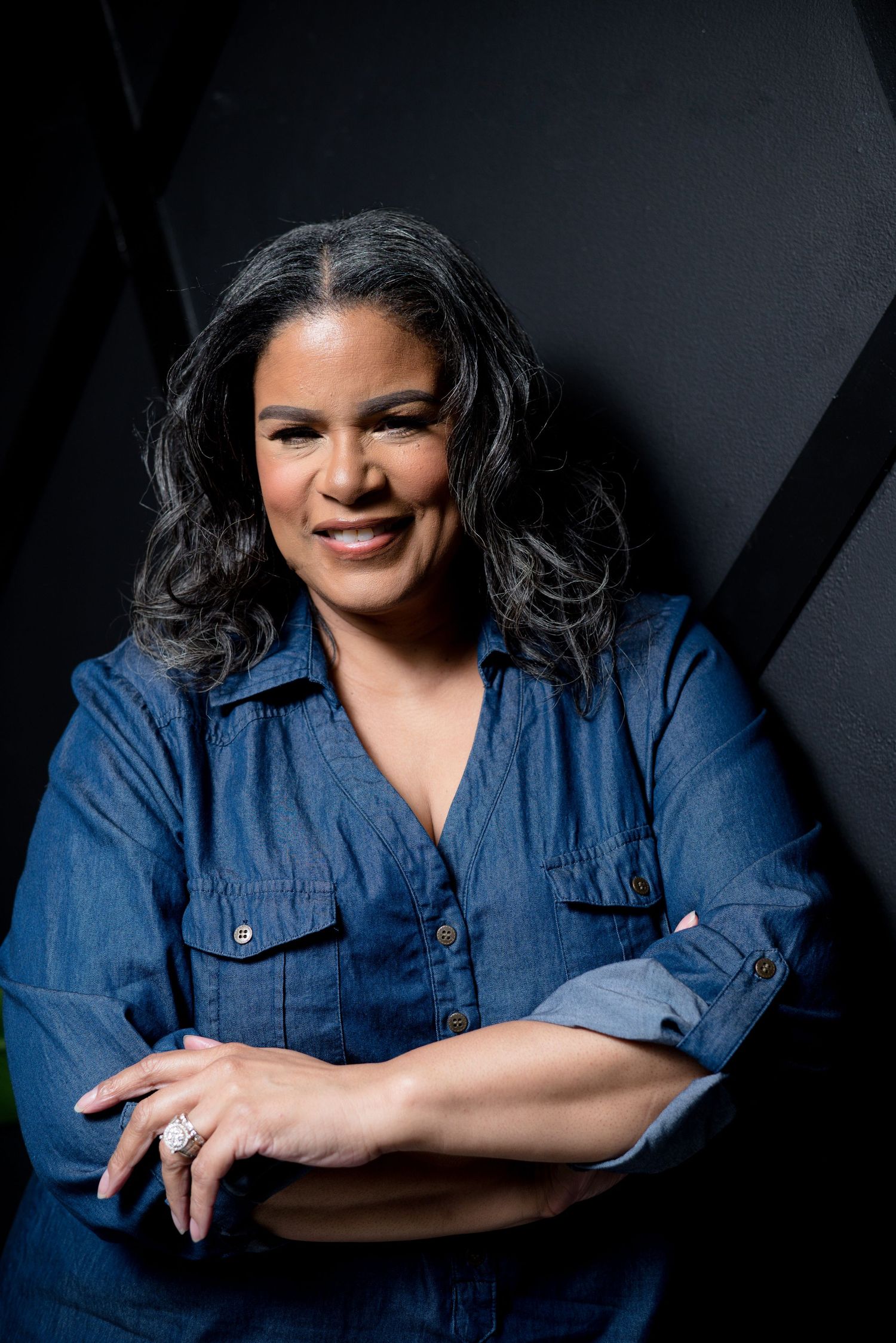 Branding photo of a female entrepreneur with her product line in Columbia, SC