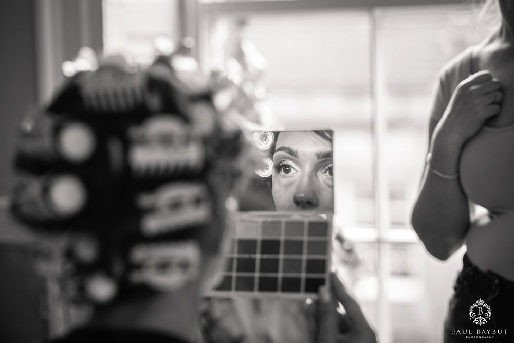 Elegant black and white portrait with soft window lighting.