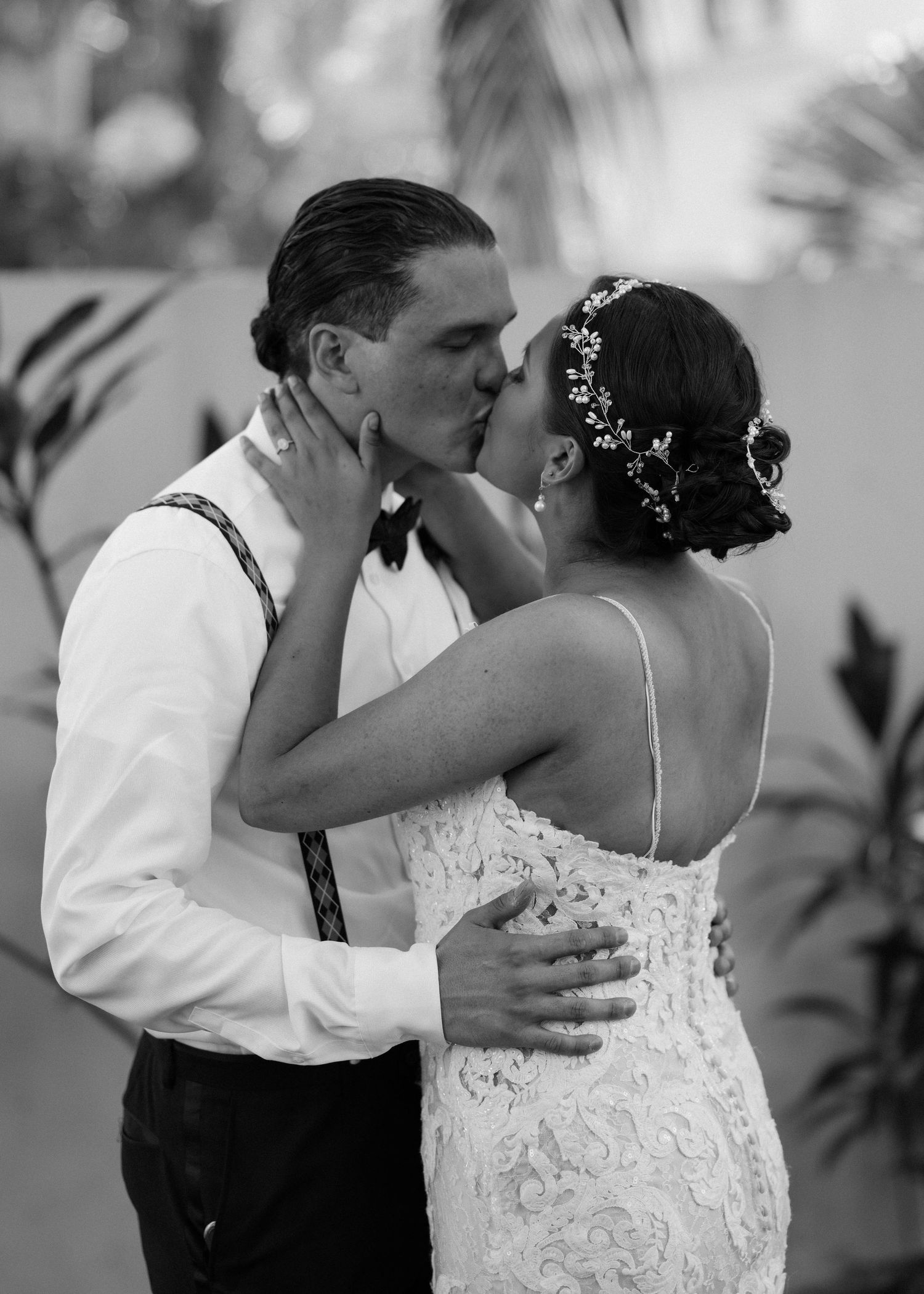 A romantic sequence of dance moves in black and white showing an intimate moment between two dancers.