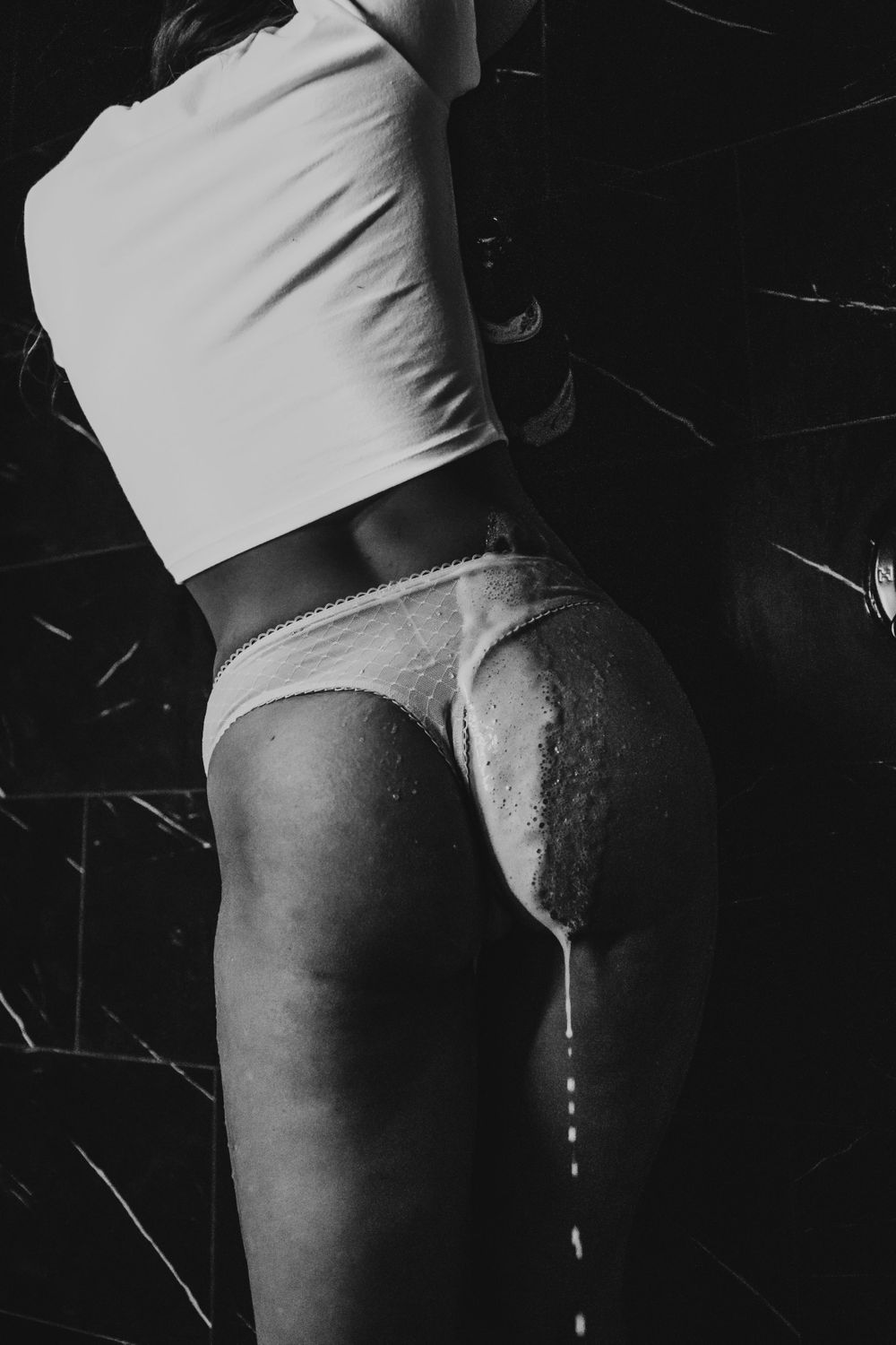 Black and white artistic photograph showing contrast between light and dark shapes.