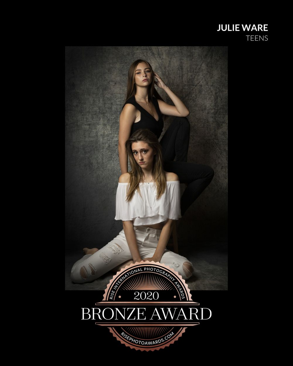 bronze award in photography, two older teenage girls one wearing white and one wearing black portrait style