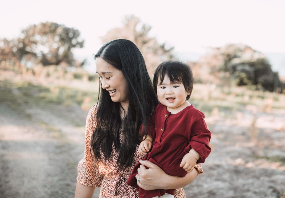 Joyful outdoor family photos with natural lighting and laughter.