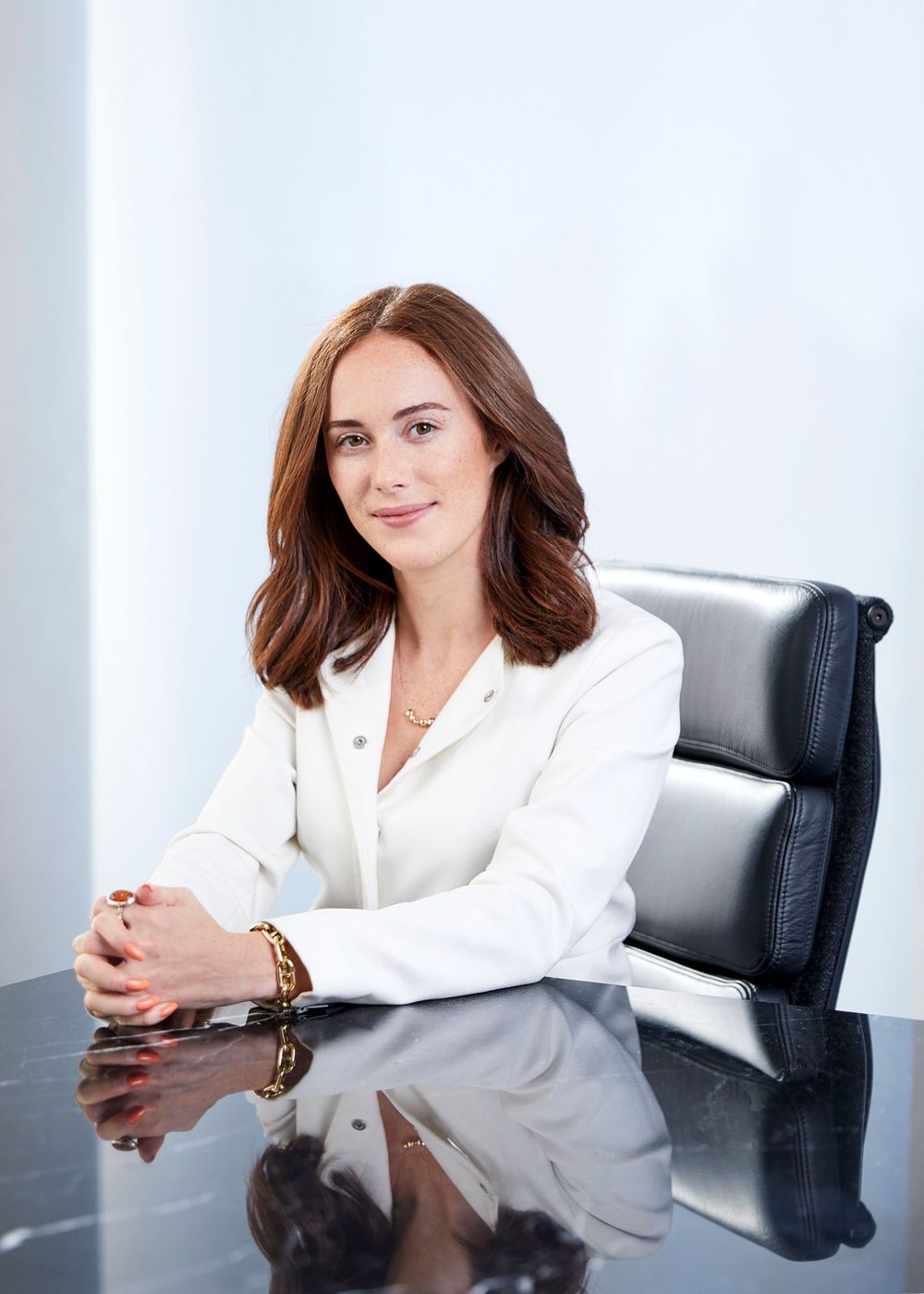 Woman in a white suit in a office