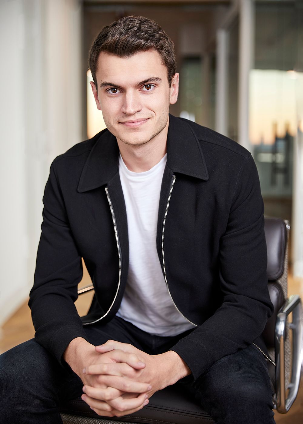 Portrait of young man in a black jacket