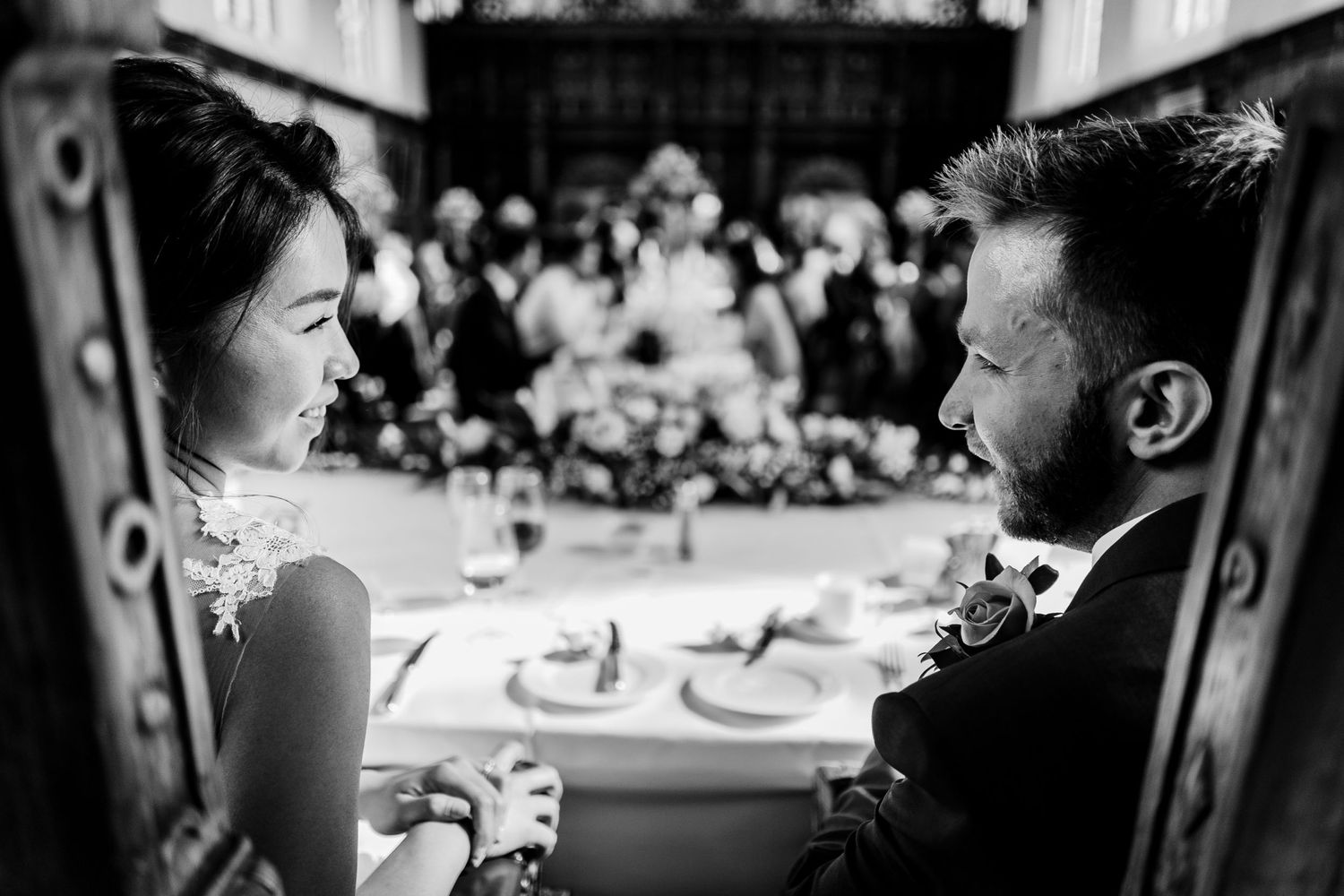 Couple exchange look during reception at Trinity College