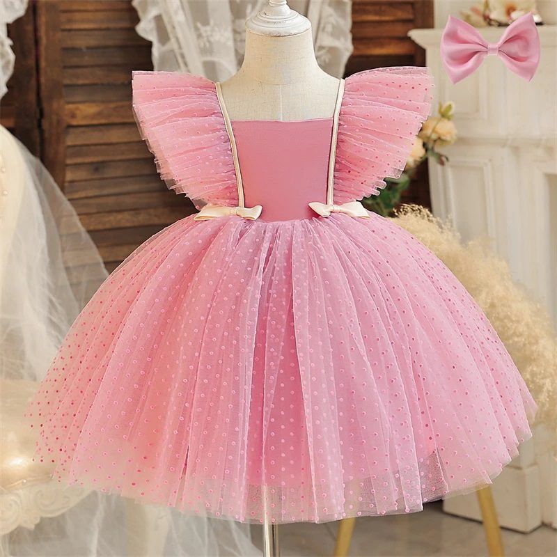 Pink tulle princess dress with flutter sleeves displayed on mannequin.