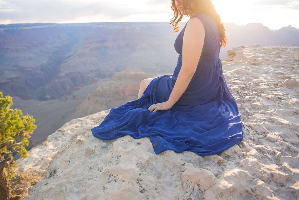 sunrise. girl looking down. blue dress. modeling photo session. grand canyon. arizona. wedding photographer