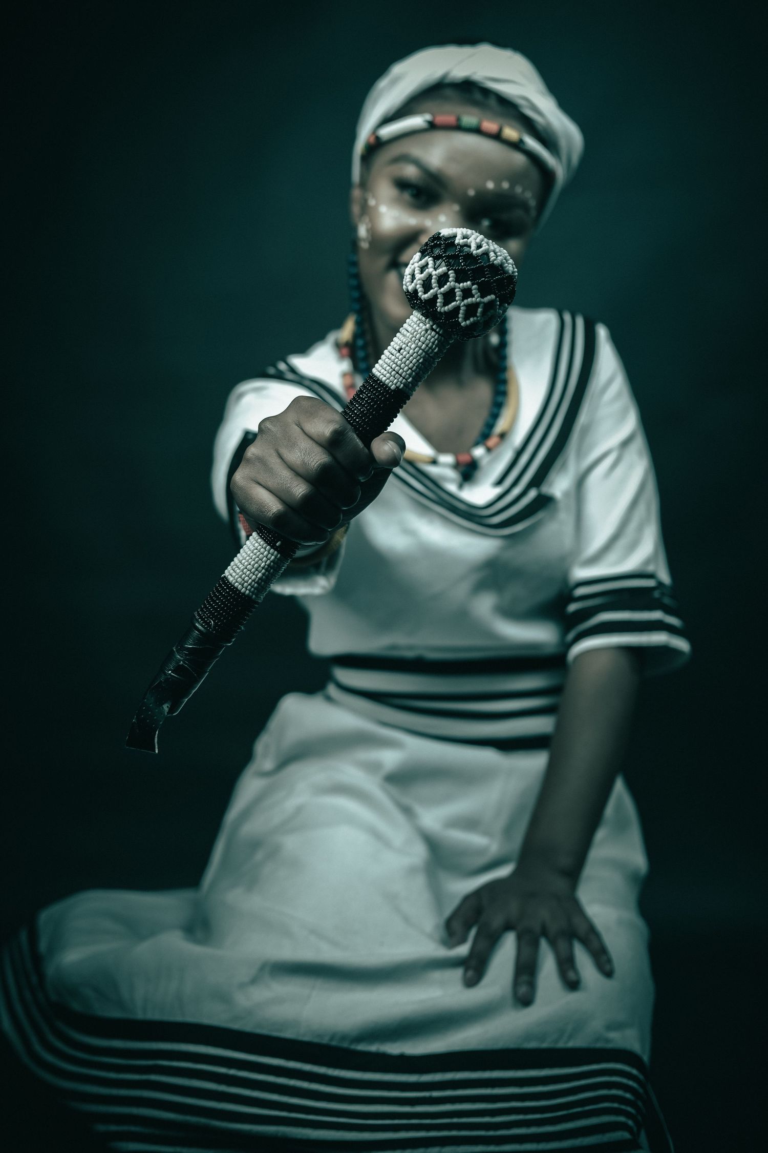 Studio shoot, of a lady celebrating her Xhosa heritage, show us her xhosa props