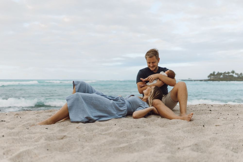 Family beach photo in Hawaii by the rocks big island photographer