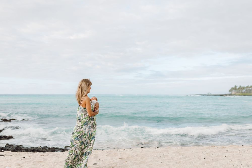 Family beach photo in Hawaii by the rocks big island photographer