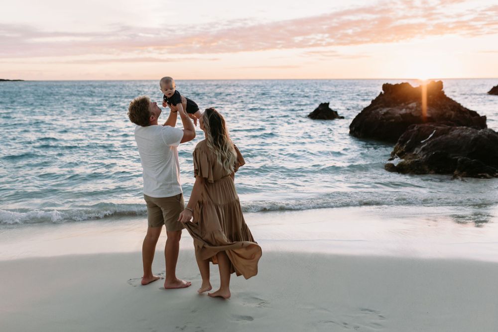 Family beach photo in Hawaii by the rocks big island photographer