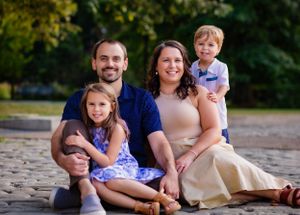 A stunning family portrait of a husband, wife and 2 young children. Picture perfect!
