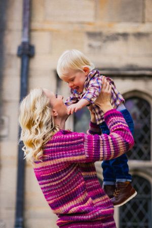 Mom plays with her young son for some candid laughs