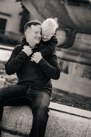 Family and son share an intimate hug