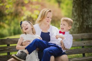 a mother and her children share a hearty laugh
