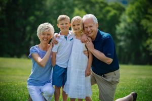 Grandparents cuddle grandkids making memories last forever