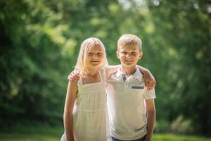 Bathed in golden sunlight, this sibling duo is picturesque perfection