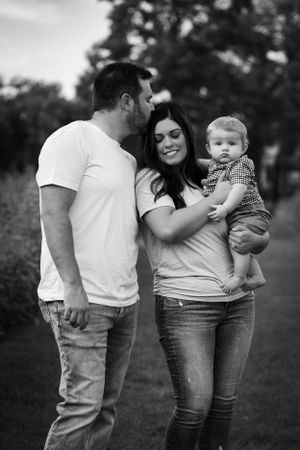 A husband and wife share an adorable, intimate moment