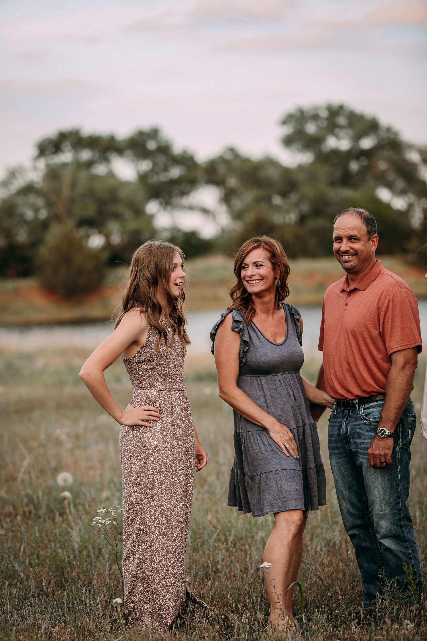 daughter mother and father laughing