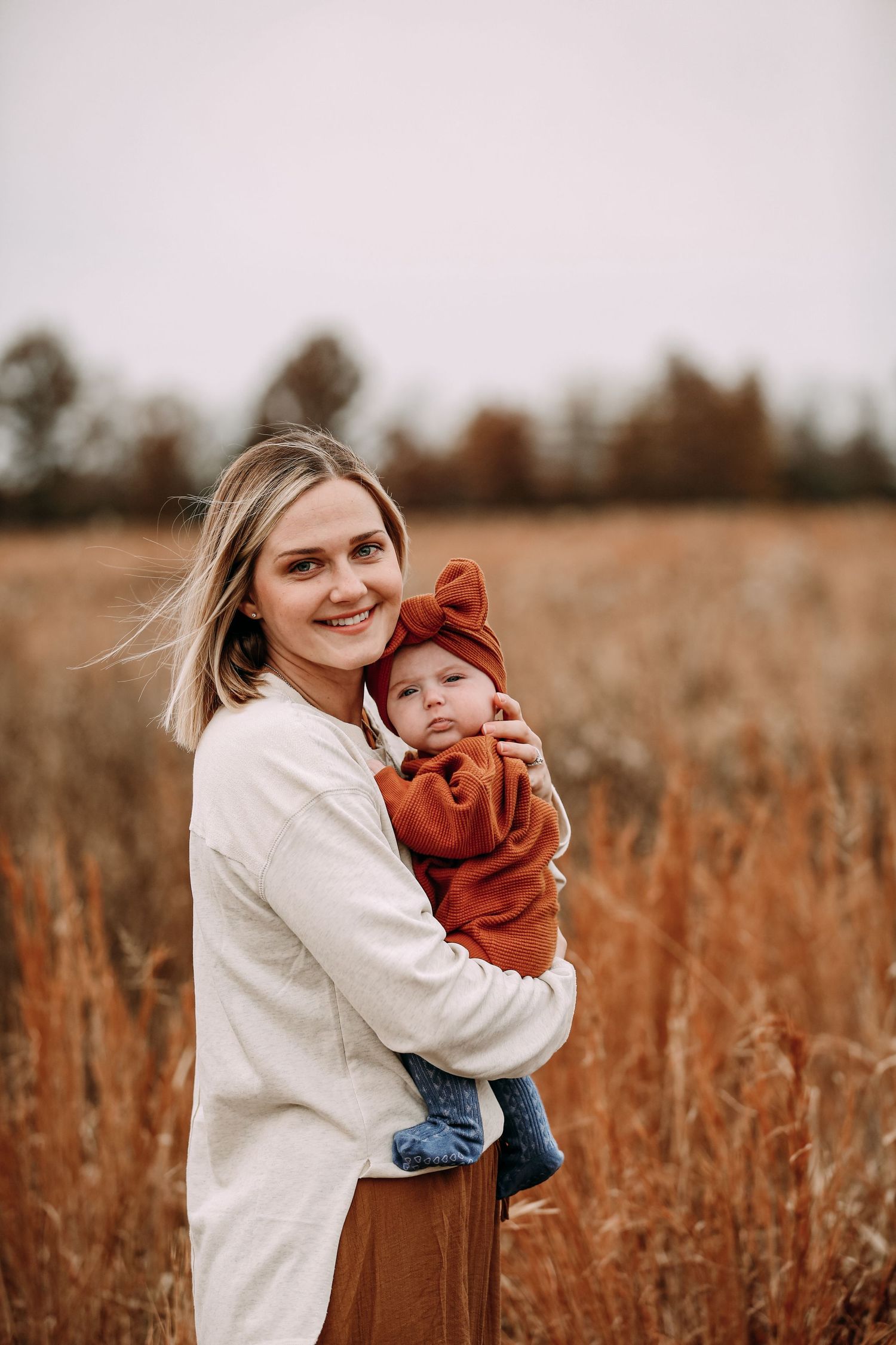 mother and baby in field