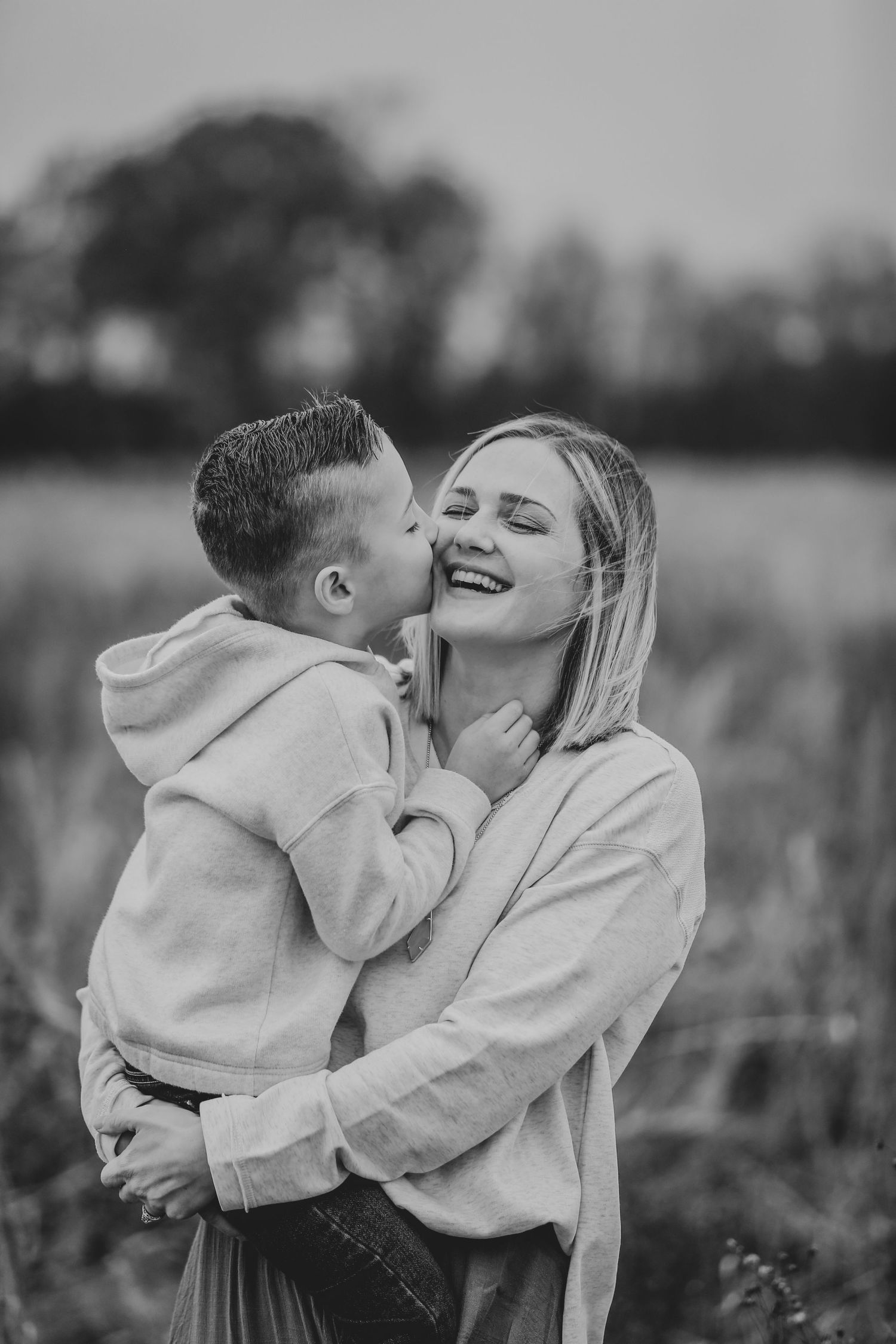 mother and sun hugging