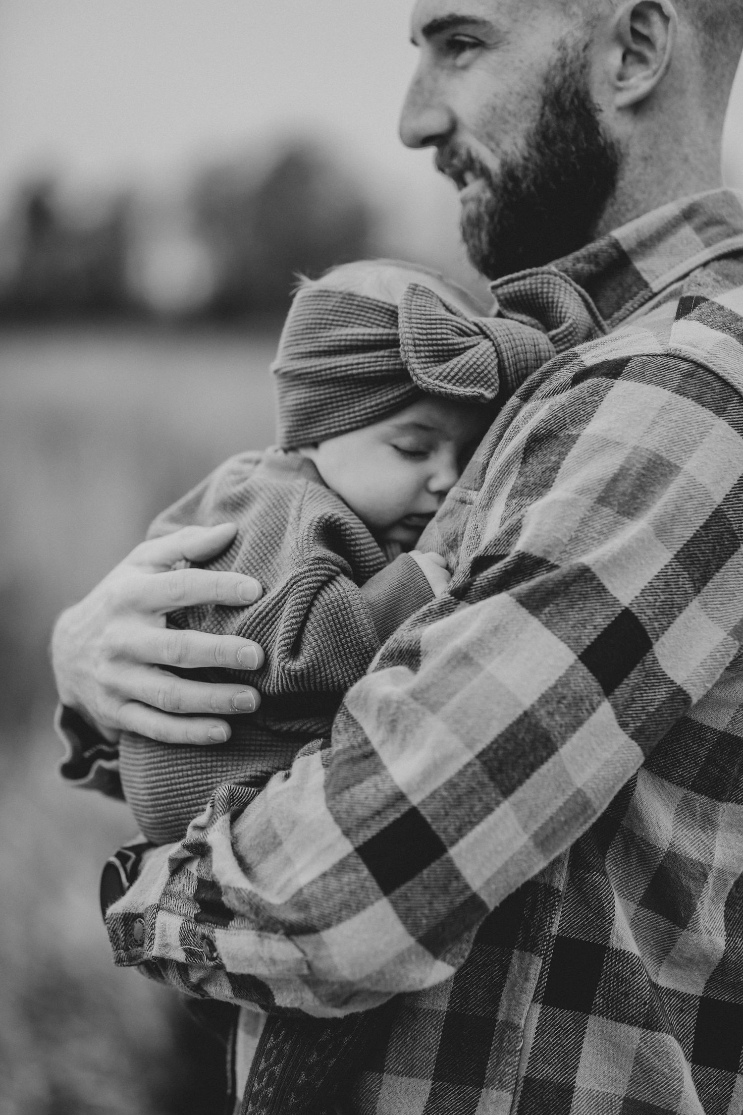 father holding baby