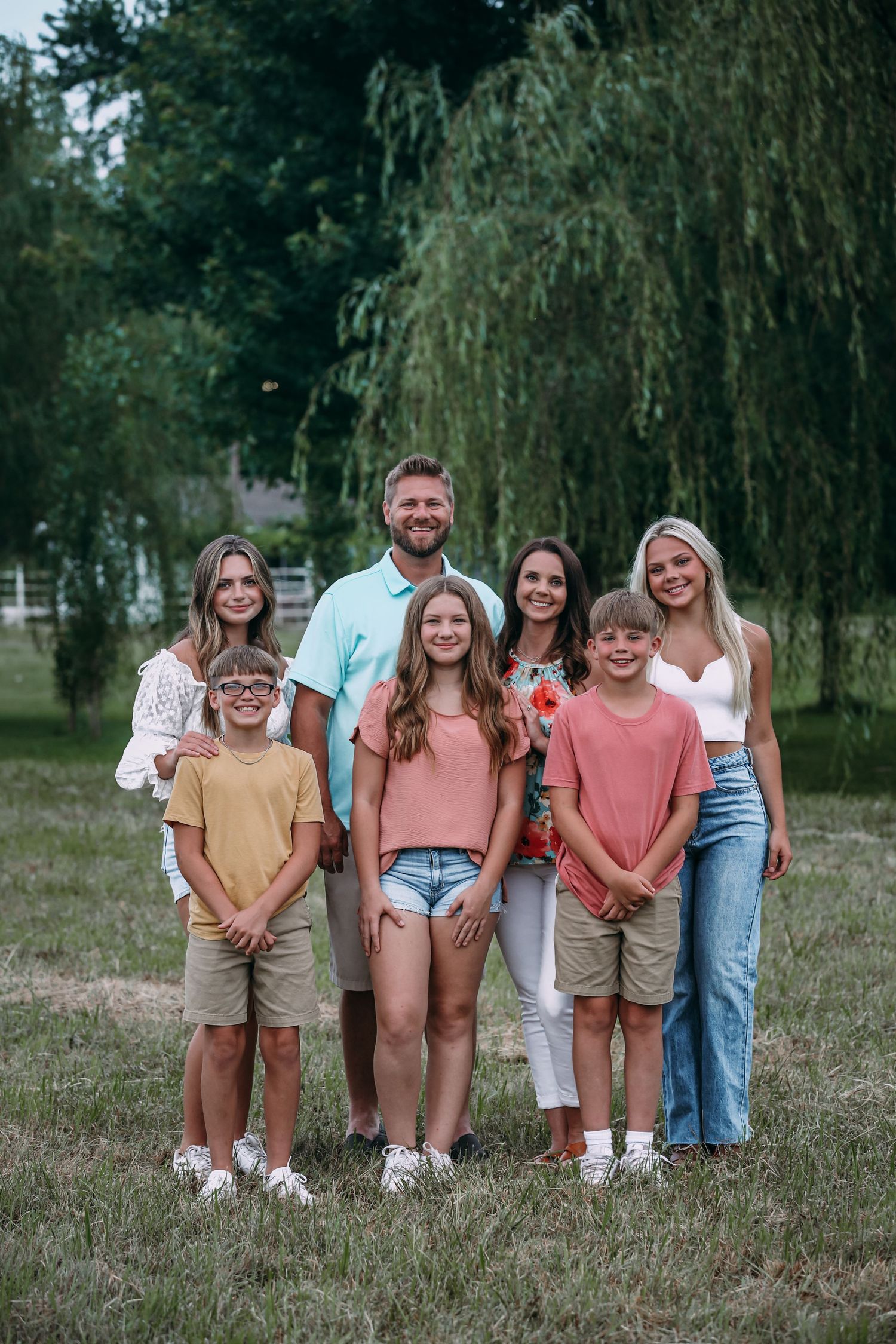 family of seven in grass