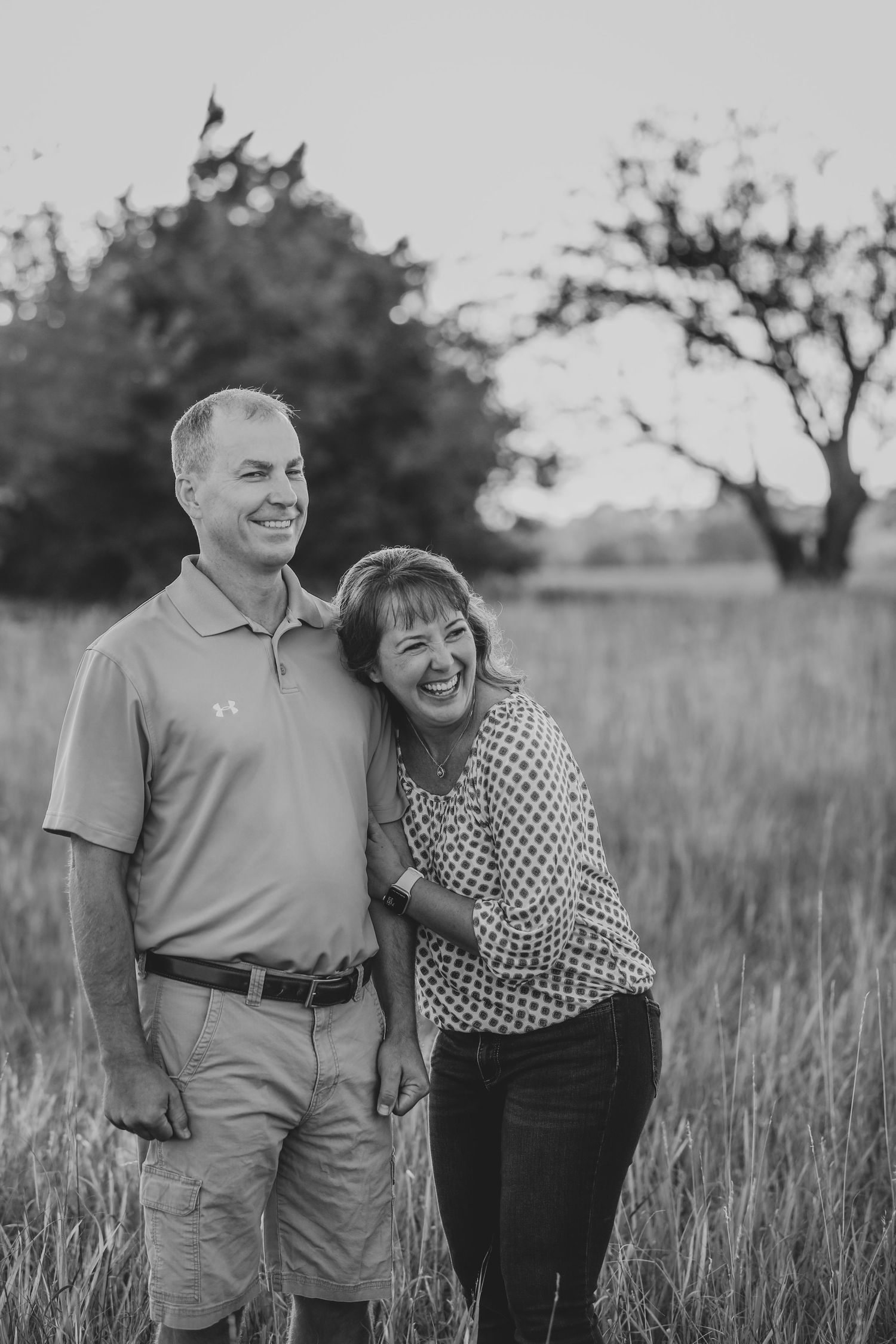 mom and dad candid in field