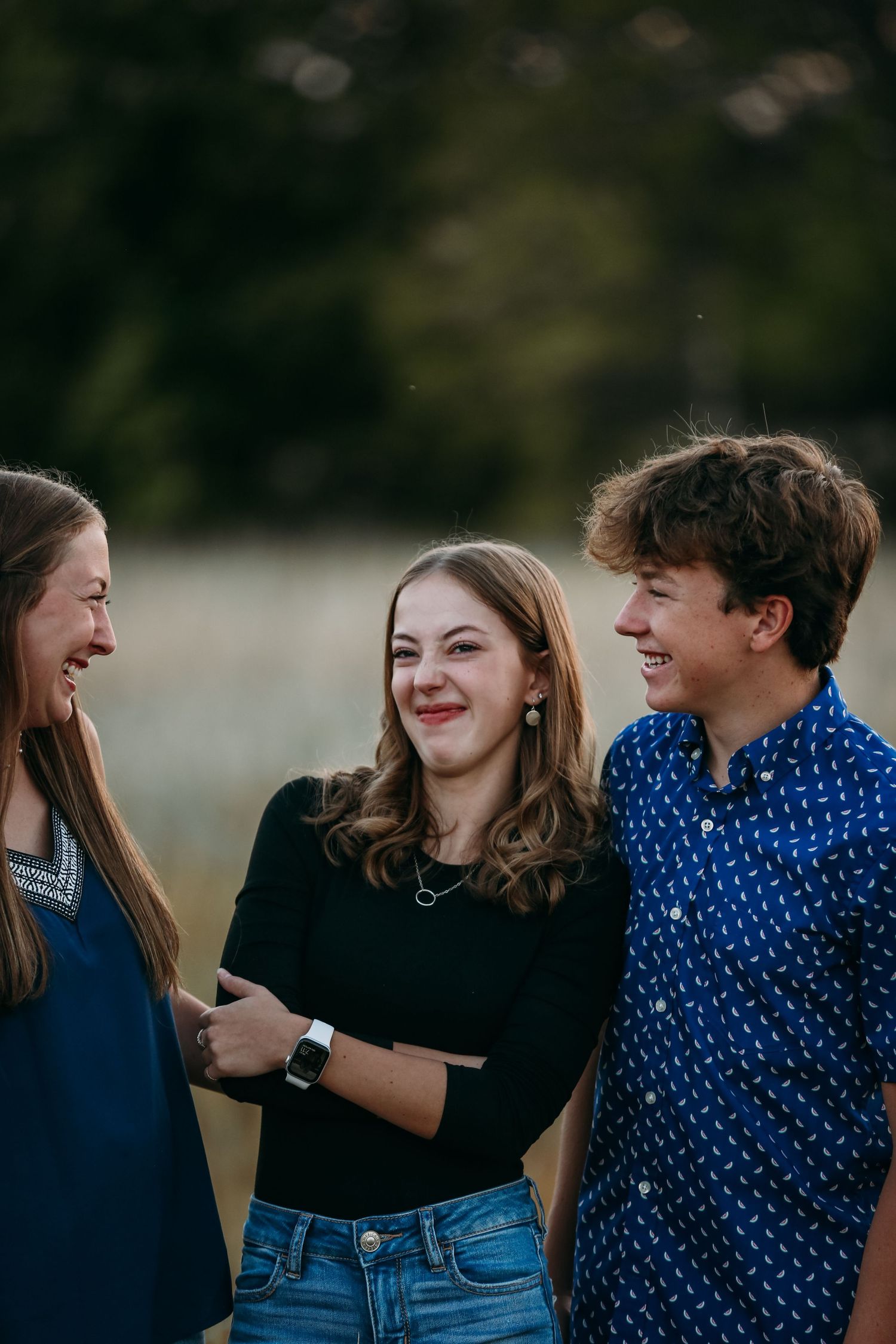 three siblings laughing