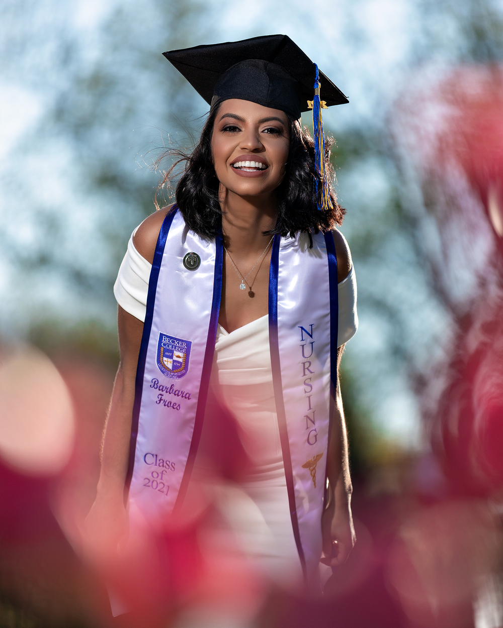 Graduation photos showing academic regalia against a soft blurred background.