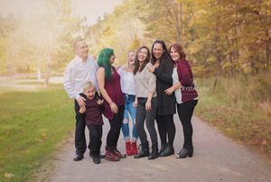 Beautiful golden hour family photo with older siblings