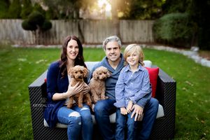 Backyard family photo with two dogs included