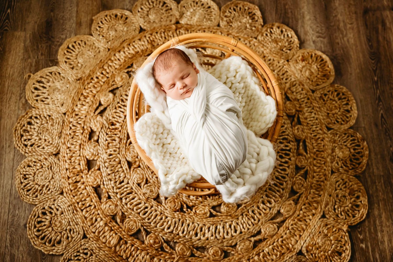 Adorable baby in a Connecticut studio photography session in white swaddle