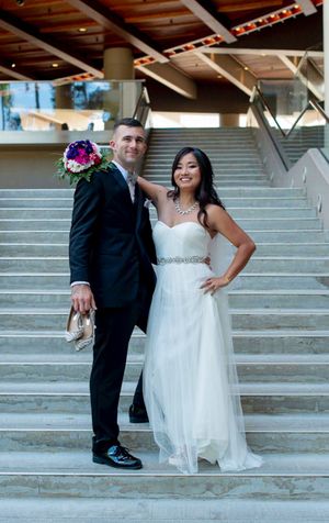 Bride and groom on stairs at Hale Koa Hotel