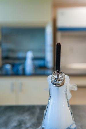 Wedding rings on science equipment in the lab with dry ice smoke