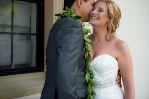 Groom kissing his bride